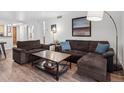 Comfortable living room featuring a sectional sofa, a wooden coffee table, and modern decor at 800 N Pearl St # 709, Denver, CO 80203