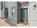 Modern entryway features a secure door, a welcome mat, and contemporary exterior accents at 1810 Irving St # 4, Denver, CO 80204