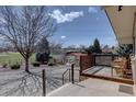 Relax on the back deck overlooking the spacious yard and park at 7890 W 43Rd Pl, Wheat Ridge, CO 80033