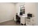 Home office with a white desk and storage, perfect for remote work at 524 E Hinsdale Ave, Littleton, CO 80122