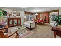 An elegant living room boasts classic decor, a dining area, plush seating, and ample natural light at 3534 Starry Night Loop, Castle Rock, CO 80109