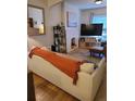 Cozy living room features a comfortable couch and stylish decor at 914 E Iowa Ave, Denver, CO 80210