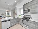 Bright kitchen with modern appliances, light wood cabinets, and open layout at 1007 Chase St, Lakewood, CO 80214