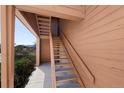 Exterior wooden staircase with handrails leads to the upper-level entrance of this well-maintained condo, enhancing its charm at 4681 S Decatur St # 227, Englewood, CO 80110