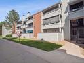 A modern condo exterior with well-maintained landscaping and multiple levels of private balconies at 14439 E 1St Dr # C11, Aurora, CO 80011
