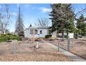Inviting single Gathering home featuring a well-kept front yard and charming curb appeal at 1994 Macon St, Aurora, CO 80010