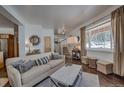 Inviting living room with staircase, hardwood floors, and large window with view at 532 Kimmes Ln, Breckenridge, CO 80424