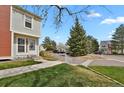 Well-maintained home with lush green lawn and mature trees in a friendly neighborhood at 6742 S Independence St, Littleton, CO 80128