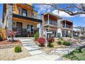 Well-manicured front yard with newly built modern three-story home and 'Coming Soon' sign at 3711 Mariposa St, Denver, CO 80211
