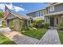 Lovely home featuring stone pathway, beautiful landscaping, and a charming entryway at 6338 S Oneida Ct, Centennial, CO 80111