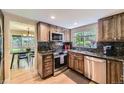Updated kitchen with granite counters, stainless appliances and wood cabinets at 6338 S Oneida Ct, Centennial, CO 80111