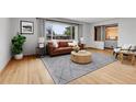 Bright living room features hardwood floors, large windows, and neutral paint at 375 Kohl St, Broomfield, CO 80020