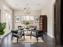 Charming living room with stylish seating, dark floors, and abundant natural light at 1214 S Fillmore St, Denver, CO 80210