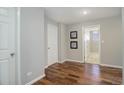 Bedroom featuring wood floors, a white closet door, and neutral wall color at 909 N Logan St # 1B, Denver, CO 80203