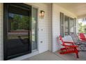 Inviting front porch with stylish seating, a charming address plaque, and freshly painted white siding at 1325 Kingsfield St, Castle Rock, CO 80104