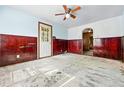 Spacious living room featuring wood flooring, paneled walls, and natural light at 12 Marshall Pl, Longmont, CO 80504