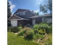 Inviting home showcasing a well-maintained lawn and colorful garden at 8229 Estes Ct, Arvada, CO 80005