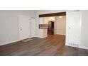 Open-concept living space featuring modern flooring and stainless steel appliances at 12033 E Harvard Ave # 208, Aurora, CO 80014