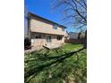 Spacious backyard featuring a lawn, patio, and a wood fence, perfect for outdoor activities at 1062 Timbervale Trl, Highlands Ranch, CO 80129
