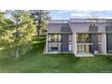 Two story house exterior featuring a cozy balcony and well-maintained lawn at 6519 Pinewood Dr, Parker, CO 80134