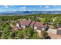 Stunning aerial view of the home with a deck and mountain views at 17575 Minglewood Trl, Monument, CO 80132