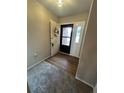 Inviting entryway featuring a black front door with a floral wreath and durable wood-look flooring at 125 S 22Nd Ave # 6, Brighton, CO 80601