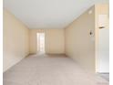 Empty bedroom with neutral carpeting, a doorway to another room, and light-colored walls at 1045 N Pennsylvania St # 303, Denver, CO 80203