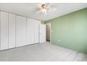 Spacious bedroom with a large closet, neutral carpet, and a ceiling fan for added comfort at 1045 N Pennsylvania St # 303, Denver, CO 80203