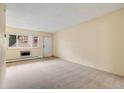Bright, carpeted living room featuring neutral walls and natural light from a window at 1045 N Pennsylvania St # 303, Denver, CO 80203