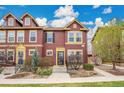 Attractive townhome with colorful siding, well-maintained landscaping, and inviting front entrance at 600 Avalon Ave, Lafayette, CO 80026