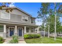 Inviting two-story home features a well-manicured lawn and front yard landscaping at 3937 Osceola St, Denver, CO 80212