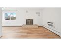 Bright living room with hardwood floors and decorative fireplace at 250 N Pearl St # 310, Denver, CO 80203
