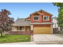 Charming two-story home with a manicured lawn and welcoming curb appeal at 5784 W 81St Cir, Arvada, CO 80003