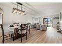 This dining area features modern table and decor, offering an ideal space for dining and entertaining at 7770 W 38Th Ave # 108, Wheat Ridge, CO 80033