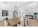 Open concept dining room with hardwood floors and large windows at 806 Ridgemont Cir, Highlands Ranch, CO 80126