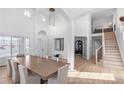 Bright and airy entryway with hardwood floors and staircase at 806 Ridgemont Cir, Highlands Ranch, CO 80126