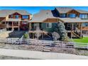 Home with a fenced yard, patio, and verdant trees at 18338 E Saskatoon Pl, Parker, CO 80134