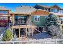 A backyard deck and fenced yard in a home for sale at 18338 E Saskatoon Pl, Parker, CO 80134