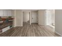 Open living space with new flooring and multiple access points at 13792 E Lehigh Ave # E, Aurora, CO 80014