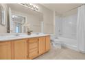 Clean bathroom with double vanity and shower/tub combo at 1050 Opal St # 102, Broomfield, CO 80020