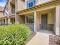 The exterior facade features a front porch and well-manicured landscape at 600 E Dry Creek Pl, Littleton, CO 80122