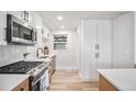 This home's bright kitchen features stainless steel appliances, wood cabinets, and durable countertops at 862 Pontiac St, Denver, CO 80220