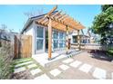 Charming backyard studio with a modern pergola and ample natural light at 3735 Inca St, Denver, CO 80211