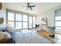 Bright living room with large windows, hardwood floors, and stylish modern furnishings at 3735 Inca St, Denver, CO 80211
