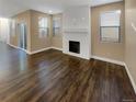 Living room with fireplace and hardwood floors at 4723 Joplin St, Denver, CO 80239