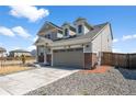 Charming two-story home with a two car garage, driveway, and landscaped yard at 13516 Waterthrush St, Parker, CO 80134