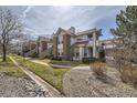 Charming townhome community with mature trees, well-manicured lawns, and inviting walkways at 3010 W Prentice Ave # J, Littleton, CO 80123