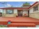Inviting front porch with a cozy swing and decorative touches, perfect for relaxing at 12079 E Louisiana Ave, Aurora, CO 80012