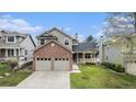 Charming two-story home featuring a brick facade and a well-maintained lawn at 9921 Spring Hill Pl, Highlands Ranch, CO 80129