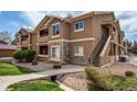 Beautiful condo with manicured landscaping, private entrance and steps leading to second floor at 4730 Copeland Cir # 204, Highlands Ranch, CO 80126